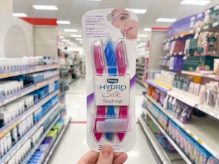 hand holding pack of Schick Hydro Silk touch up razors
