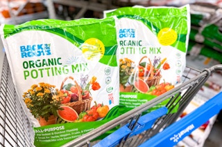 Two bags of Back to the Roots Organic Potting Soil in Walmart shopping cart