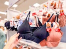 hand grabbing a hanes bra off a target shelf