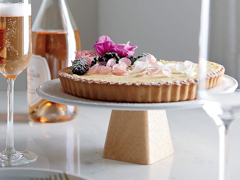 a cake and champagne flutes from crate and barrel