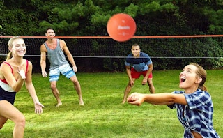 People playing volleyball outside