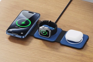 Electronics charging using the UCOMX 3 in 1 Charging Station on a desk.