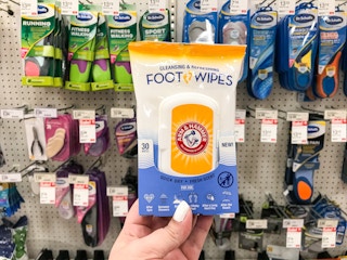 hand holding a pack of arm & hammer foot wipes at target
