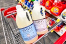 2 jugs of mrs meyers laundry detergent in a cart