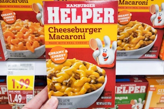 hand holding a box of hamburger helper