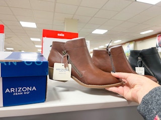 womens boots being held in store