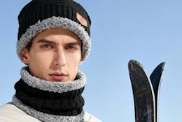 a man wearing a beanie and scarf