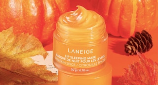 a small jar of orange laneige lip mask surrounded by pumpkins