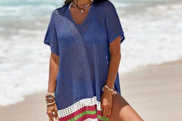 a woman wearing a swimsuit coverup