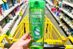 hand holding dollar general fructis shampoo