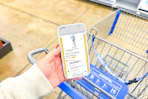 hand holding a smartphone displaying a 1-clip coupon deal