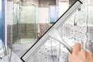 a shower door being cleaned