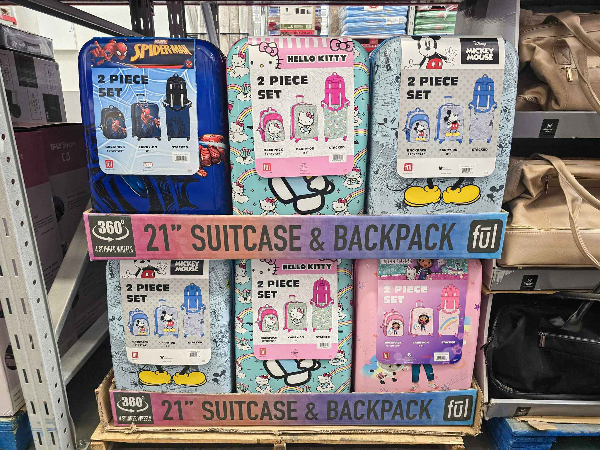 a stack of disney licensed luggage sets 