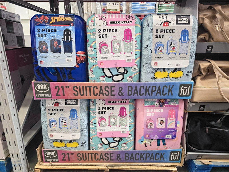 a stack of disney licensed luggage sets 