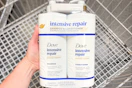 hand holding dove hair care set over shopping cart