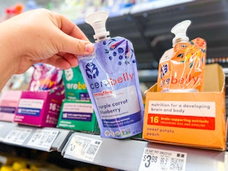 hand holding a pouch of cerebelly baby food puree on walmart shelf