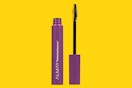 a tube of mascara on a yellow background
