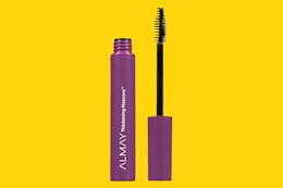 a tube of mascara on a yellow background