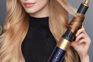 a woman using an airstyler tool