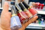 hand holding bottles of revlon nail polish