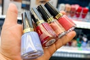 hand holding bottles of revlon nail polish