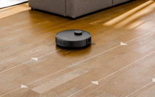 a robot vacuum on a wooden floor