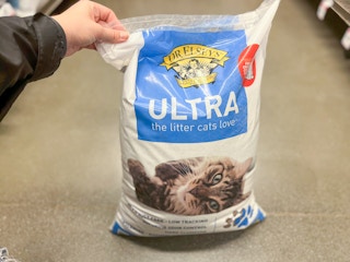 a bag of cat litter on the floor