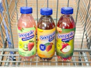 3 snapple sitting in a walmart cart