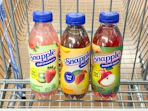 3 snapple sitting in a walmart cart
