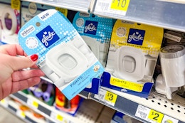 hand grabbing a glade small room air freshener