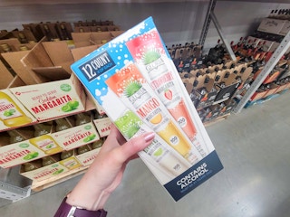 hand holding a box of cocktail pops