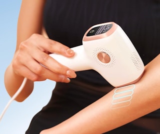 a laser hair removal device on a wooden table 
