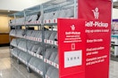kohls self pickup sign and bins inside of a kohls store