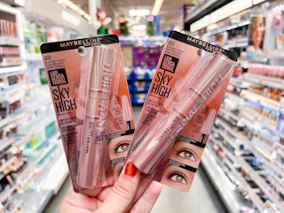 Hand holding two packs of Maybelline Sky High mascara