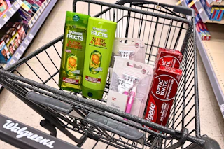 garnier fructis shampoo, colgate toothpaste, and walgreens razors in a cart