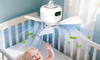 a fan blowing air in a baby's crib