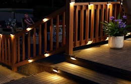 deck light on the railing of an outdoor deck