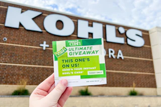 someone holding up some instant kohls cash from the Kohl's Cash ultimate giveaway