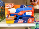 nerf agility blaster sitting on a target shelf