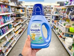hand holding snuggle laundry item in walgreens