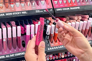 person testing nyx professional makeup liquid lipstick in ulta store