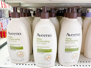 three bottles of aveeno lotion