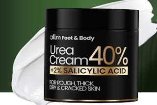a black and gold jar of foot cream