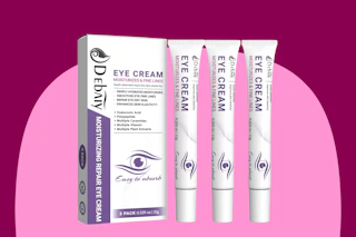 A white and purple box next to three white tubes, all of which say EYE CREAM prominently