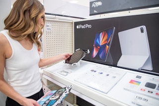 person looking at ipad pro in store