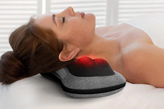 a person laying their neck on a Shiatsu massager