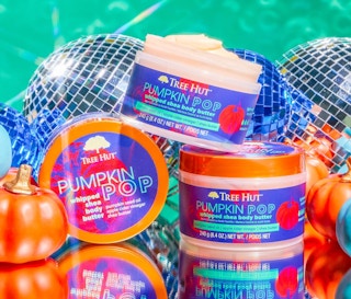 three jars of body butter with pumpkins in front of disco balls