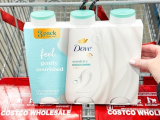 handing placing dove body wash in shopping cart