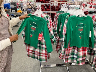 A woman looking at Christmas pjs