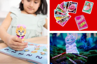 toys and a Barbie card games on display